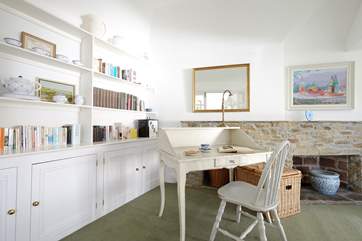 A desk at one end of the sitting-room.