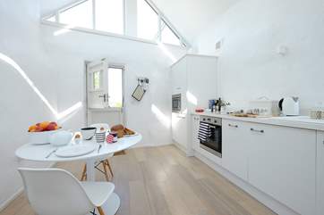 The kitchen and dining areas.