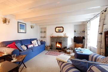 There is an open fire in the sitting-room.