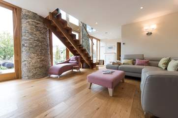 Looking back at the stairs leading to the first floor from the downstairs comfy space.