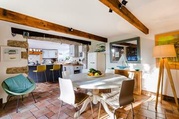 The dining-area with the kitchen in the background.