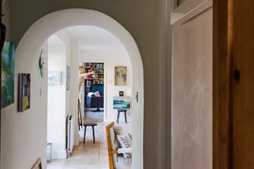 Looking from the kitchen through the first sitting-area to the sitting-room in the distance.