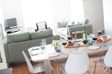 The dining-area in the foreground and the sitting-area to the back.