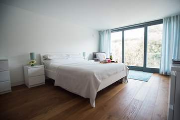 The gorgeous master bedroom has a lovely bathroom and balcony.