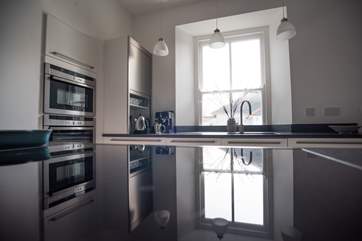 Granite worktops add a touch of elegance.