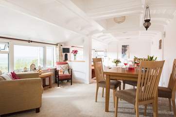 The open plan sitting/dining-room with that amazing ceiling and large picture windows to make the most of the views.