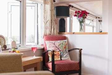 Or a chair in the window with a good book and a nice glass of something cold.
