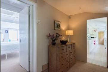 The hallway between the kitchen and bedroom 1.