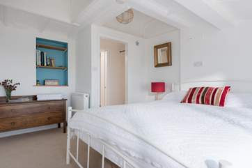This spacious bedroom is light and the carriage ceiling continues through this room to the one next door.