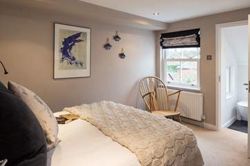 The second bedroom has a comfy double bed and en suite bathroom.
