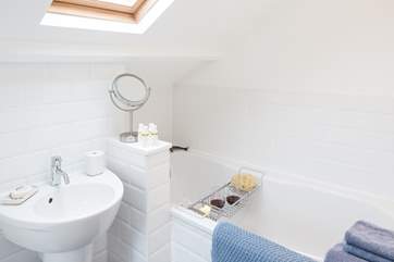 The en suite bathroom has a hand held shower attachment, and REN products invite you to luxuriate in the bath.