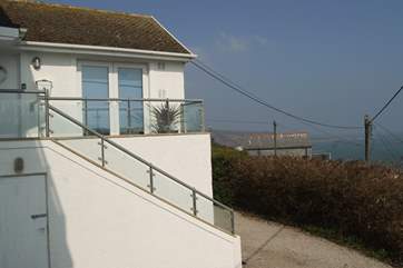 Steps lead up to the front door and another flight takes you up to your top floor apartment.