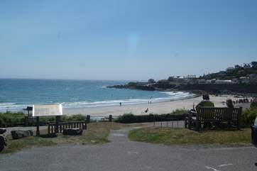 The large crescent shaped beach is sandy at low tide with room for relaxing with a picnic, sand castle building or a ball game or two.