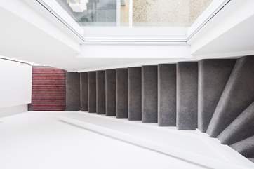 The stairs from the front door up to the apartment.