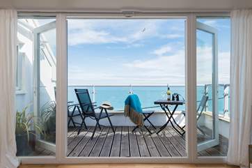 Open the doors up and bring the outside in, the balcony then becomes an extension of the living-room.