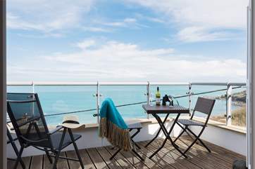 The balcony has sea views in every direction.