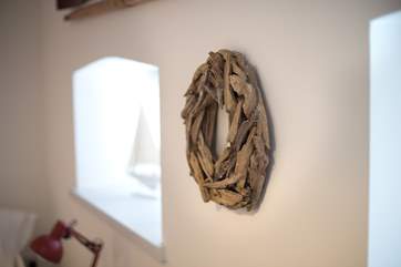 Artwork on the walls adds character to the room.