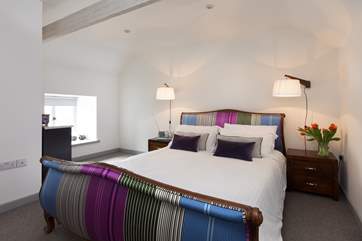 Laze in bed with views out over the surrounding countryside through the window