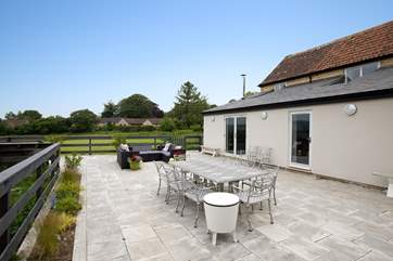 The huge terrace with room for al fresco dining, lounging and of course soaking in the hot tub with the view stretching out before you.