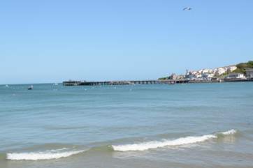 Swanage bay has a safe sandy beach, just inviting you to build a sandcastle or two.