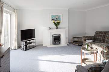 The spacious sitting room has a gas flame effect fire for cooler evenings.