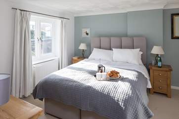 The master bedroom has a super-comfy 5ft bed and TV, perfect for breakfast in bed.