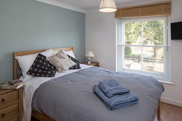 The double bedroom with a comfy 4ft 6 bed, looks out onto the high street.
