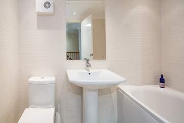 The family bathroom, perfect for a soak at the end of the day. A fitted shower has recently been installed over the bath, not featured in this photo.