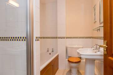 The family bathroom has a separate shower.