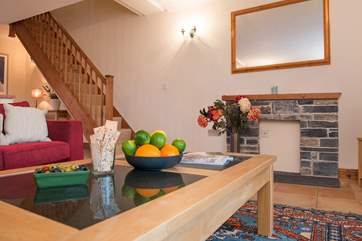 The stairs lead off from the lounge area
