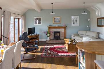 The open plan living-room is a bright and sociable space, the perfect place to relax.
