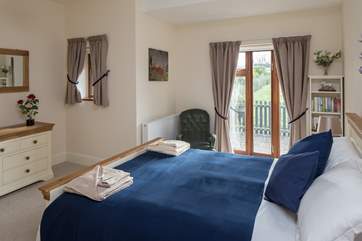 The master bedroom has a high quality 5ft bed and looks out onto the garden.