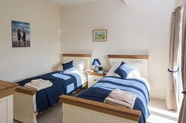 The light twin room has super comfy 3ft beds and a narrow French door looking over the garden.