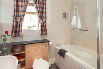 The family bathroom has a fitted shower with drench head.