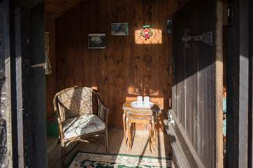 The summer-house is an unexpected little haven, and has beautiful hand-made curtains.