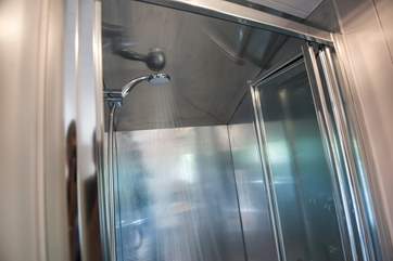 With hot shower, wash-basin and proper flushing toilet of course.
