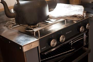 There is a an electric grill and mini oven and a two ring has hob and fridge all clevery designed to fit in.