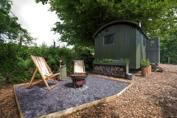 There is a firepit barbecue and some deckchairs for further relaxing times and a bit of outdoor cooking.