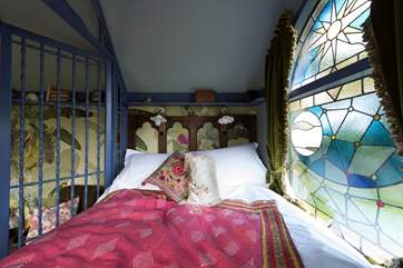 The gorgeous king-size bed has a window at the foot looking out over the countryside.