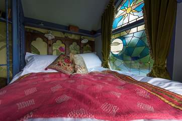 The stained glass window lets in the most exquisite light throughout the day.