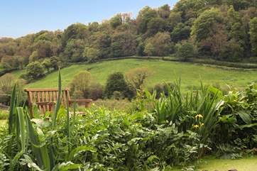 What a peaceful place to sit and relax. With the pond in front of you and the valley stretching away down the hill.