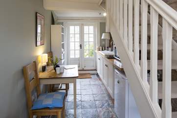 Stairs go up to the sitting/bedroom above.