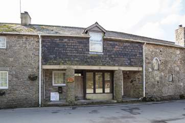 The exterior of the cottage seen from the village road