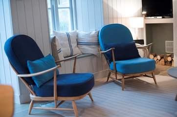 Refurbished Ercol armchairs are perfect in the living-room.