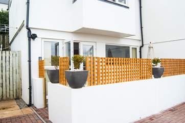 The little courtyard is screened for privacy.