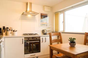 An electric oven and gas hob.