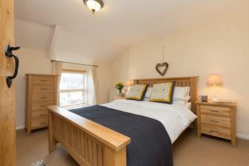 This is the double bedroom on the first floor. A bright room looking out to the front of the cottage, with plenty of built-in storage.