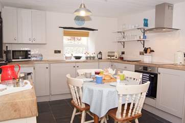 The kitchen has just been refurbished. Please note that the Rayburn is ornamental only - you have a brand new fitted oven and hob for your cooking.