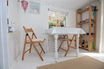 The dining-table sits under the eaves so please mind your head.