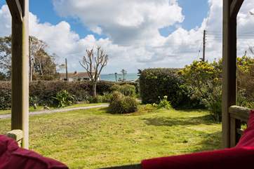 Sit and take in the views of the garden and the sea beyond.